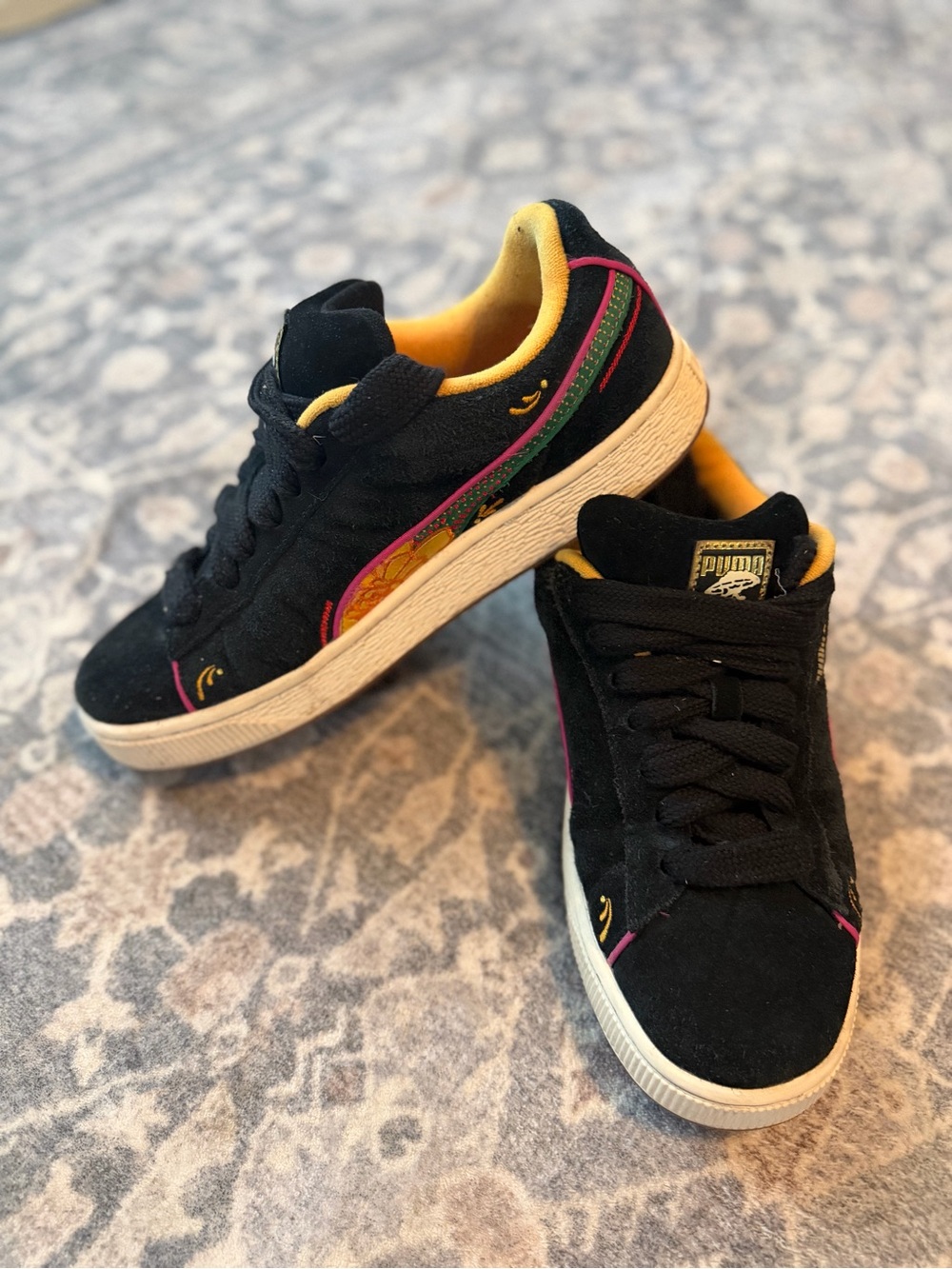Puma Black Suede Sneakers with Yellow Lining and Pink & Green Accents